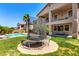 Spacious backyard featuring a trampoline, lush grass, and a view of the multi-story home at 15792 W Desert Mirage Dr, Surprise, AZ 85379