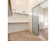 Large walk-in closet with shelves and hanging rods, providing ample storage space at 15792 W Desert Mirage Dr, Surprise, AZ 85379