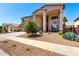Charming home featuring desert landscaping, ample seating, and a bright, sunny exterior at 15792 W Desert Mirage Dr, Surprise, AZ 85379