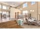 Spacious living room with high ceilings, tile floors, and a view of the upper level at 15792 W Desert Mirage Dr, Surprise, AZ 85379
