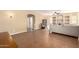 Comfortable living room with tile flooring, built-in shelves, and cozy seating area at 15792 W Desert Mirage Dr, Surprise, AZ 85379