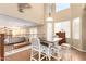 Cozy living area with high ceilings, and comfortable seating arrangement at 15792 W Desert Mirage Dr, Surprise, AZ 85379