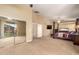 Expansive main bedroom featuring a four-poster bed, ample space, and sliding glass door at 15792 W Desert Mirage Dr, Surprise, AZ 85379