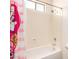 Clean shower tub combination featuring tile walls and a shower head at 15792 W Desert Mirage Dr, Surprise, AZ 85379