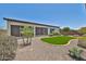 Idyllic backyard showcasing gravel landscape, turf and lush green plants at 17082 S 182Nd Ave, Goodyear, AZ 85338