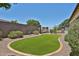 Beautiful backyard offering gravel landscape, turf, and desert landscaping at 17082 S 182Nd Ave, Goodyear, AZ 85338