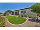 Lovely backyard with gravel, artificial turf, manicured bushes, and privacy fence at 17082 S 182Nd Ave, Goodyear, AZ 85338