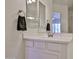 Bathroom sink with a towel and modern fixtures offering a clean and functional space in this home at 17082 S 182Nd Ave, Goodyear, AZ 85338