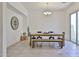 Well-lit dining room with rustic table, bench, and sliding glass door at 17082 S 182Nd Ave, Goodyear, AZ 85338