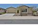 Charming single-story home with a two-car garage, desert landscaping, and an inviting front entrance at 17082 S 182Nd Ave, Goodyear, AZ 85338