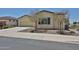 Inviting single-story home with well-maintained landscaping, a two-car garage, and a serene neighborhood setting at 17082 S 182Nd Ave, Goodyear, AZ 85338