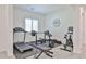 Home gym equipped with a treadmill, weights, and exercise bike, perfect for staying active at 17082 S 182Nd Ave, Goodyear, AZ 85338