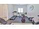 Well-equipped home gym featuring a treadmill, weight rack, and exercise bike at 17082 S 182Nd Ave, Goodyear, AZ 85338