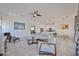 Spacious living area with modern decor open to kitchen and small dining area at 17082 S 182Nd Ave, Goodyear, AZ 85338