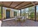 Inviting covered patio featuring a dining table with seating and a brick-paved floor perfect for outdoor entertaining at 17082 S 182Nd Ave, Goodyear, AZ 85338