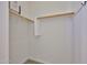 Empty walk-in closet with shelving, offering ample storage space for clothes and accessories in an organized manner at 17082 S 182Nd Ave, Goodyear, AZ 85338