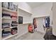 Organized walk-in closet with ample shelving and hanging space, maximizing storage and convenience at 17082 S 182Nd Ave, Goodyear, AZ 85338