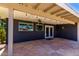Covered back patio with dark brick and a ceiling fan at 1804 S Standage Cir, Mesa, AZ 85202