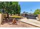 Shaded backyard with a lush lawn and mature trees at 1804 S Standage Cir, Mesa, AZ 85202