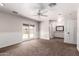 Bedroom features neutral carpet, ceiling fan, wainscotting, and access to a sink and full bath at 1804 S Standage Cir, Mesa, AZ 85202
