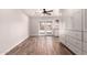 Bonus room with built-ins, light colored walls, and wood-look floors at 1804 S Standage Cir, Mesa, AZ 85202