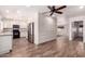 Spacious kitchen with white cabinets, wood-look floors and stainless steel appliances at 1804 S Standage Cir, Mesa, AZ 85202