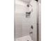 Tiled shower with built in shower caddy and glass door at 1804 S Standage Cir, Mesa, AZ 85202