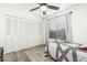 Bedroom with a window, a closet with folding doors and vinyl flooring at 18818 N 12Th Ave, Phoenix, AZ 85027