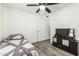 Bedroom with TV and vinyl floors. Single bed at 18818 N 12Th Ave, Phoenix, AZ 85027