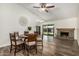 Bright dining room adjacent to a fireplace and sliding glass doors to the yard at 18818 N 12Th Ave, Phoenix, AZ 85027
