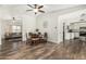 Inviting dining area with wood floors, featuring seamless access to the living room and kitchen at 18818 N 12Th Ave, Phoenix, AZ 85027