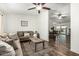 Inviting living room with a comfortable brown sofa, area rug, and open access to the dining area at 18818 N 12Th Ave, Phoenix, AZ 85027