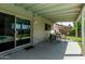 Covered outdoor patio area perfect for entertaining, with table and chairs and view of the pool at 18818 N 12Th Ave, Phoenix, AZ 85027