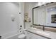 Modern bathroom features a shower-tub combination and a vanity with storage at 19910 W Mulberry Dr, Buckeye, AZ 85396