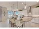 Modern kitchen features a large island with seating and stylish pendant lighting at 19910 W Mulberry Dr, Buckeye, AZ 85396