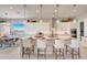 Bright and spacious kitchen featuring a large island with pendant lighting and modern appliances at 19910 W Mulberry Dr, Buckeye, AZ 85396