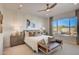 Serene main bedroom featuring a neutral color scheme, large window with natural light, and stylish furnishings for relaxation at 19910 W Mulberry Dr, Buckeye, AZ 85396
