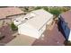 Aerial view showing house's location near well maintained landscaping and desert environment at 19961 N Coyote Lakes Pkwy, Surprise, AZ 85378