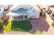 Aerial view of backyard with a patio and a well-manicured lawn and landscaping at 19961 N Coyote Lakes Pkwy, Surprise, AZ 85378