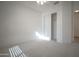 Bright bedroom with large closet, neutral carpet, and ceiling fan at 19961 N Coyote Lakes Pkwy, Surprise, AZ 85378