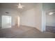 Spacious living room with tile flooring and great natural light at 19961 N Coyote Lakes Pkwy, Surprise, AZ 85378
