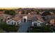 Beautiful aerial view of a home with desert landscaping and mountain backdrop at 20115 E Sonoqui E Blvd, Queen Creek, AZ 85142