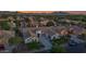 Expansive aerial shot of a beautiful home with mountain views and lush greenery at 20115 E Sonoqui E Blvd, Queen Creek, AZ 85142