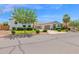 A single-story home with manicured landscaping, a circular entryway, and a spacious driveway at 20115 E Sonoqui E Blvd, Queen Creek, AZ 85142
