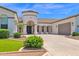 Charming single story home showcasing a circular entryway, manicured landscaping, and a spacious driveway at 20115 E Sonoqui E Blvd, Queen Creek, AZ 85142