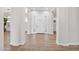 Bright foyer featuring hardwood floors, a white door, and white trim at 20115 E Sonoqui E Blvd, Queen Creek, AZ 85142