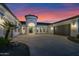 Stunning home exterior with a turret entrance, large driveway, and manicured landscaping at 20115 E Sonoqui E Blvd, Queen Creek, AZ 85142