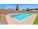 Sparkling pool features fountains, a sitting area, and artificial turf at 20115 E Sonoqui E Blvd, Queen Creek, AZ 85142