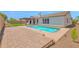 Backyard pool and patio area, perfect for relaxation and outdoor gatherings at 20115 E Sonoqui E Blvd, Queen Creek, AZ 85142
