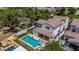 Expansive backyard boasts a sparkling pool, covered patio, and lush landscaping, creating a private outdoor oasis at 20437 W White Rock Rd, Buckeye, AZ 85396